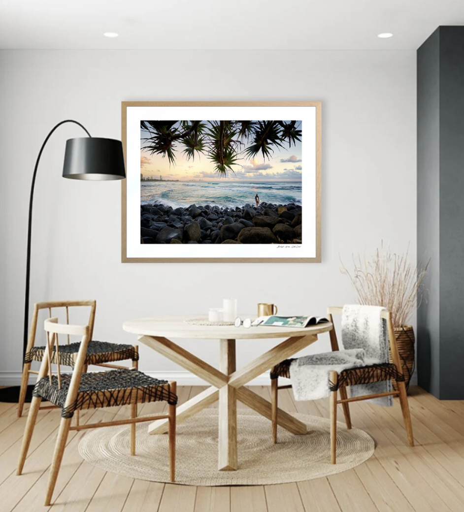 Framed coastal art in styled dining room